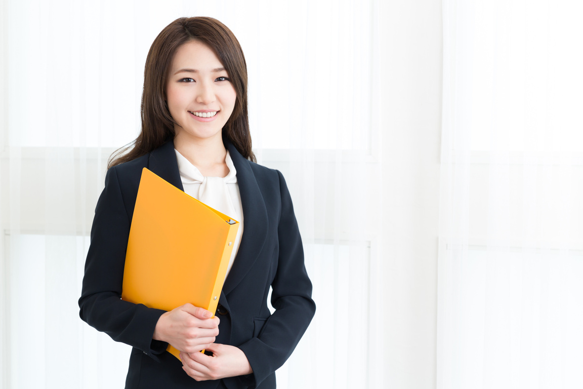 Portrait of a Manager Holding a Ring Binder